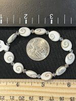 Swirl shell bracelet with accent crystals